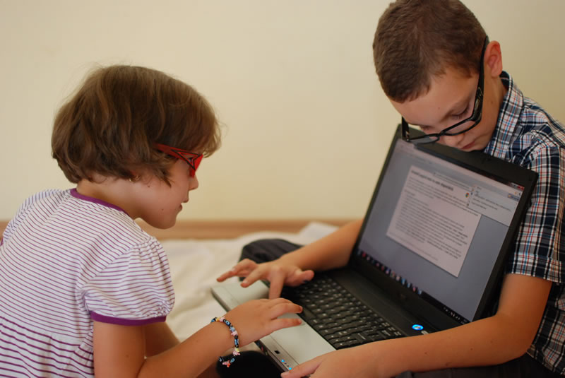 Kids with Computer Glasses playing on laptop
