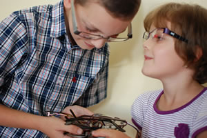 glasses parts in hands